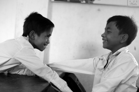 Chan Chao Loy (or ‘Loy’, right) and his friend are playing in their class room. Both are waste pickers. (Photo © Lee Yu Kyung 2013) 