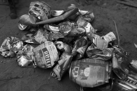 Cans have been crashed flat before selling for recycling. 1 kilogram of cans can be sold for 200 riels (approximately 5 cent). (Photo © Lee Yu Kyung 2013) 