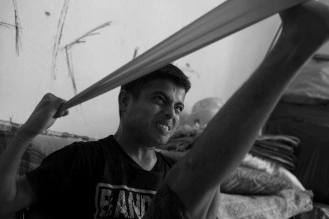 Mohammad Rafique (18) has been living in Malaysia for 6 months after two months of captivity in smugglers’ jungle camp in Southern Thailand. Yet he still has had difficulties to walk and his body yet to be recovered from paralysis. Most of boat people are forced to bend their body by smugglers while boat journey and detention in the jungle camp. He and some of Rohingya refugees in Malaysia have been doing exercise twice a day. (Photo © Lee Yu Kyung) 