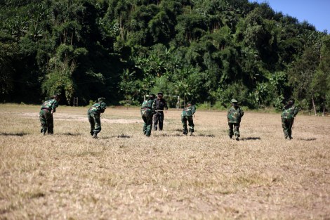 Kachin youths in Education and Economy of Development for Youth (or EEDY) training session. The Course involves military training with gun made of wood Kachin history and English etc. After training everyone goes back to ordinary life. However, Kahin youths all over the country have tried to reach their home land to take EEDY course. (Photo © Lee Yu Kyung)