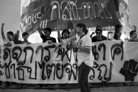 Anti-coup student activists at Democracy Monument in Bangkok, Thailand on June 25 2015. These 14 plus students are from Bangkok and Khon Kaen province in North East. The activists have declared New Democracy Movement (or NDM) a day ago, which falls on the 83rd anniversary of the Siamese Revolution of 1932. (© Lee Yu Kyung 2015)